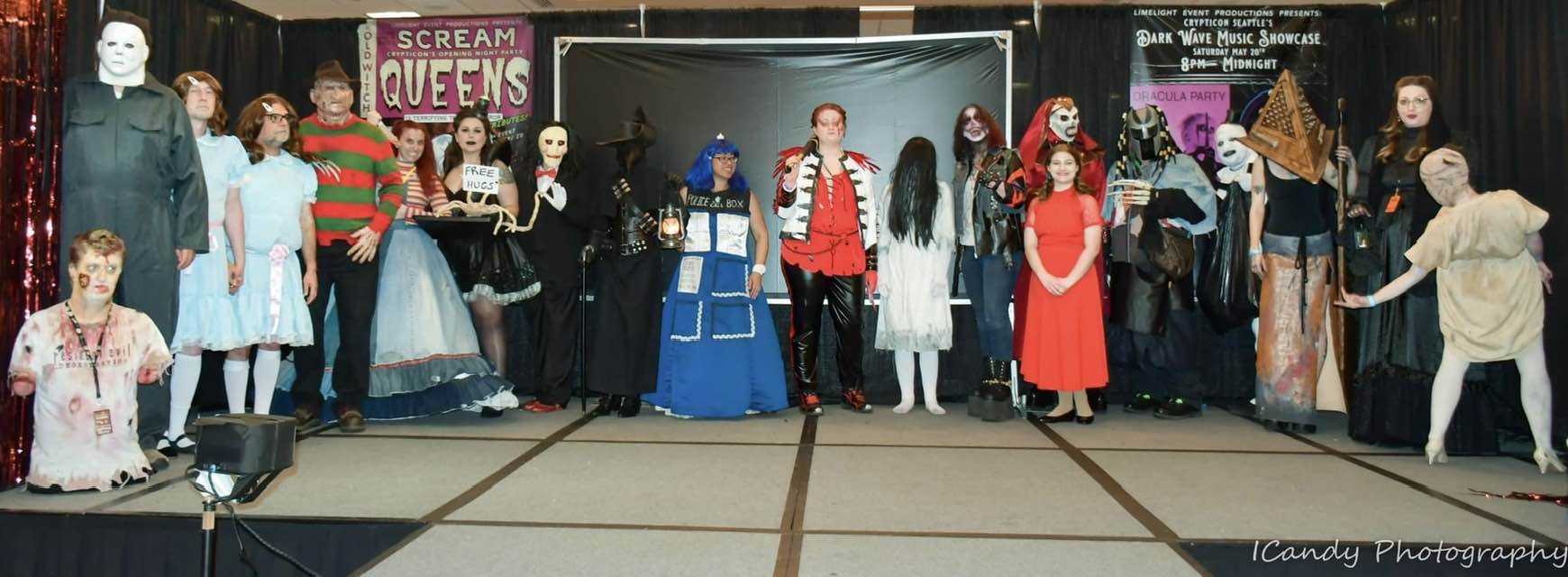 A group of people posing for a photo in costumes.