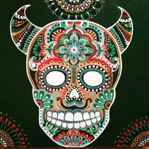 A vibrant sugar skull artwork by an artist, set against a stark black backdrop.