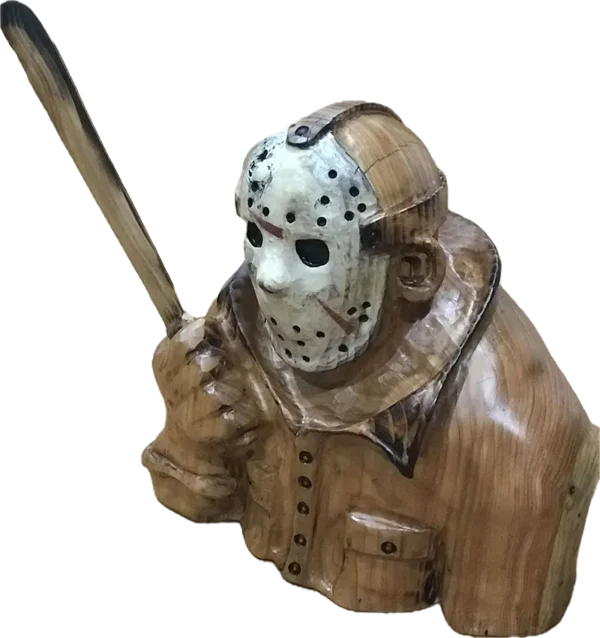 This is a wooden sculpture depicting a figure donned in a hockey mask and gripping a machete, designed in the manner of an iconic horror movie antagonist.