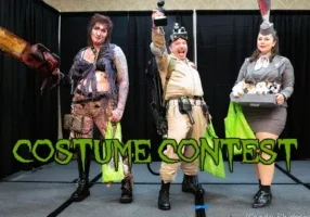 A group of people in various costumes on stage for a costume contest, holding props and posing for a photo perfect for your website's homepage.