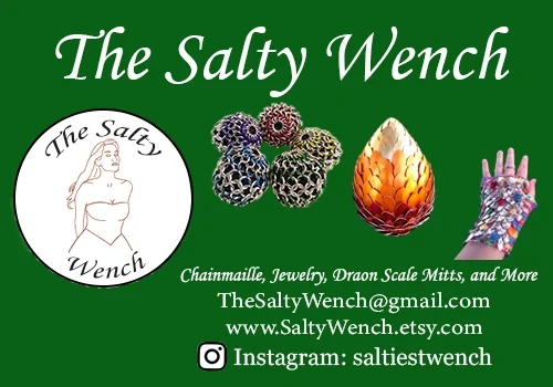 This is a promotional image for "The Salty Wench," a pirate-themed restaurant. The advertisement features the restaurant's logo - a feminine character, and showcases pieces of chainmaille jewelry and dragon scale mitts. It also provides the contact information for potential patrons to reach out to the establishment.