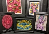 Five framed artworks with colorful, weird, surreal, and fantasy-themed illustrations displayed against a dark background.