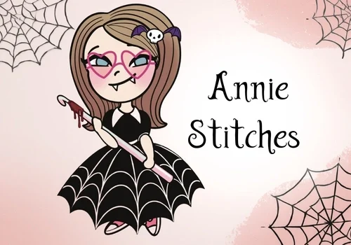 Cartoon girl in black spiderweb dress, heart glasses, fangs, "Annie Stitches" text; spiderweb corners complete the Annie Stitches vibe.
